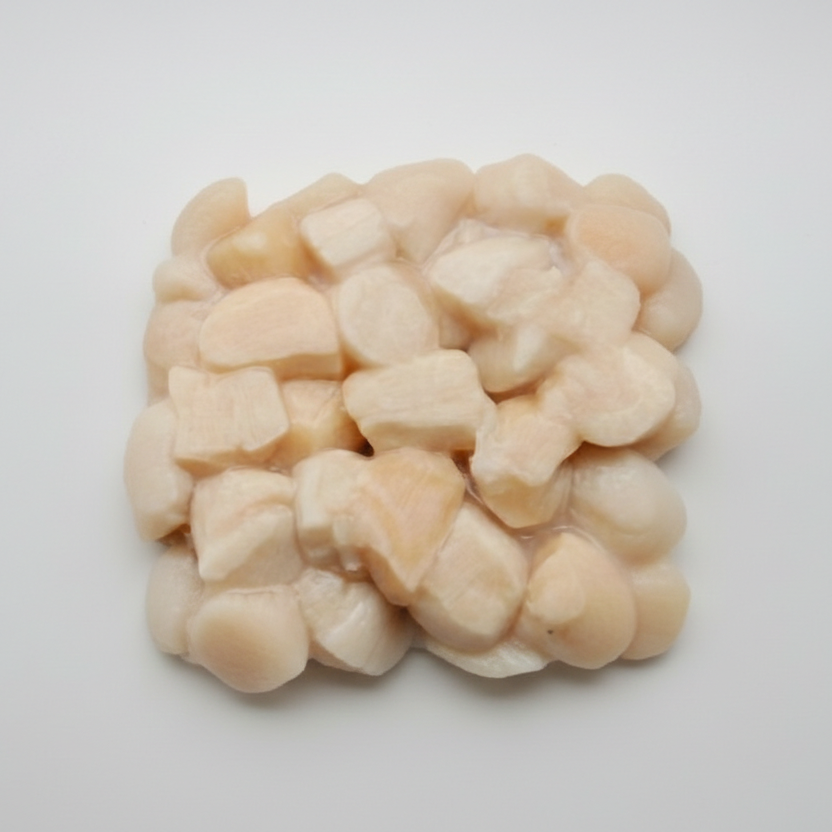Intershell seafood guide image showing raw dry scallops and golden seared scallops with lemon and herbs, comparing dry scallops vs wet scallops.