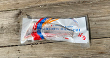 Packaged product labeled 'Crown Hamachi' on a wooden surface